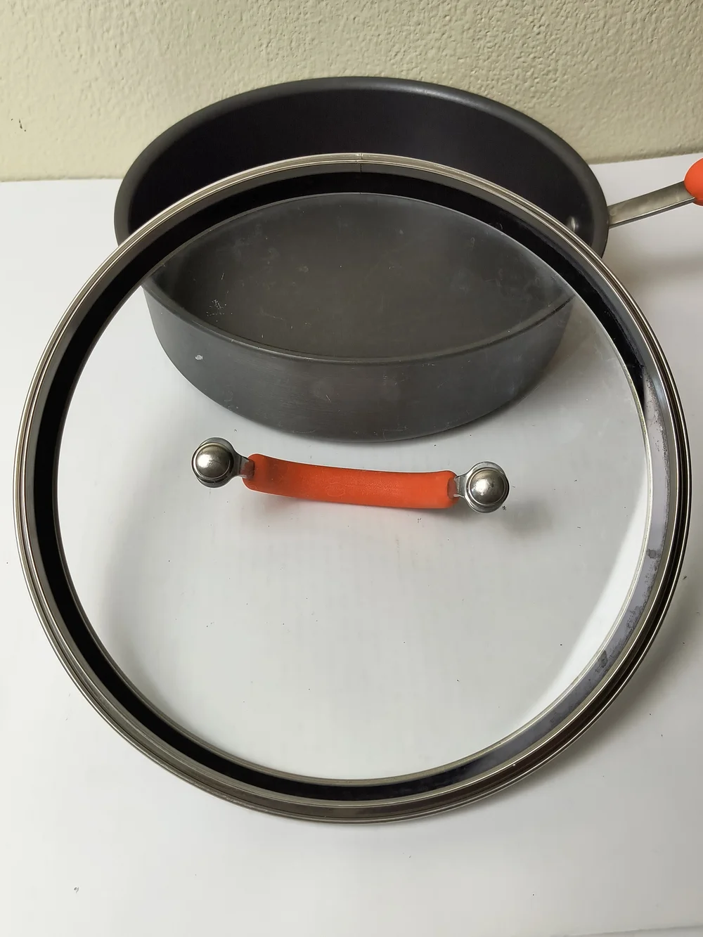 Rachael Ray 3QR/2.8L Black Sauté Pan with Orange Silicone Handle and Lid Grip